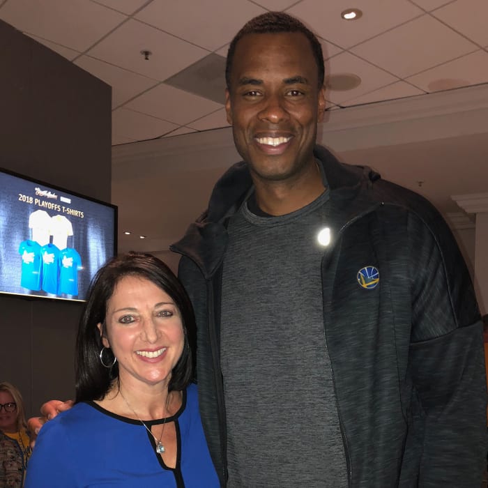 Debbie Spander with client and Warriors assistant coach Jarron Collins.